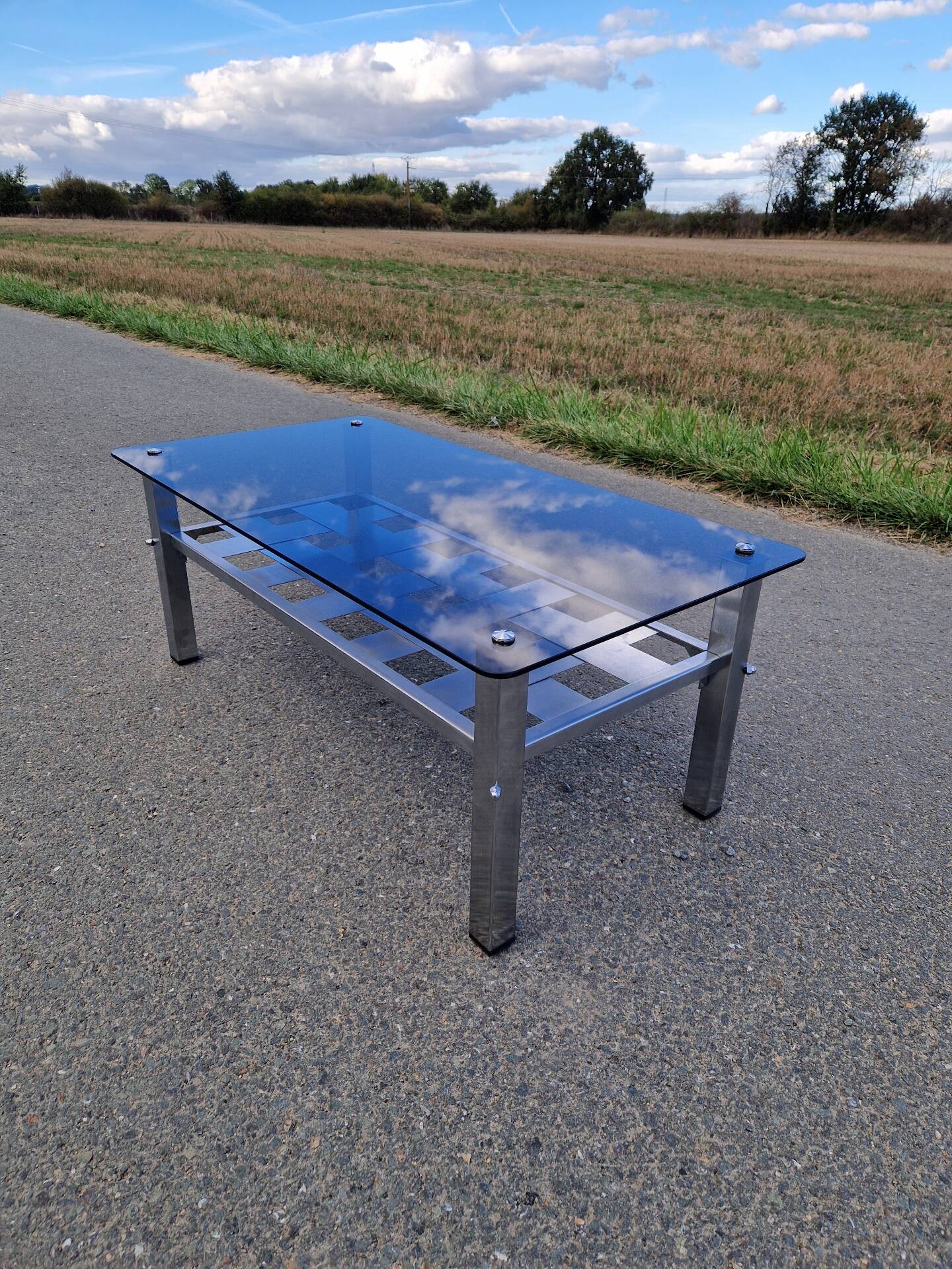 Stainless steel and smoked glass coffee table