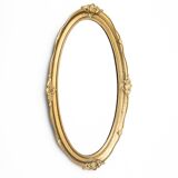 Oval mirror in a golden frame