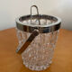 Ice bucket with its pliers