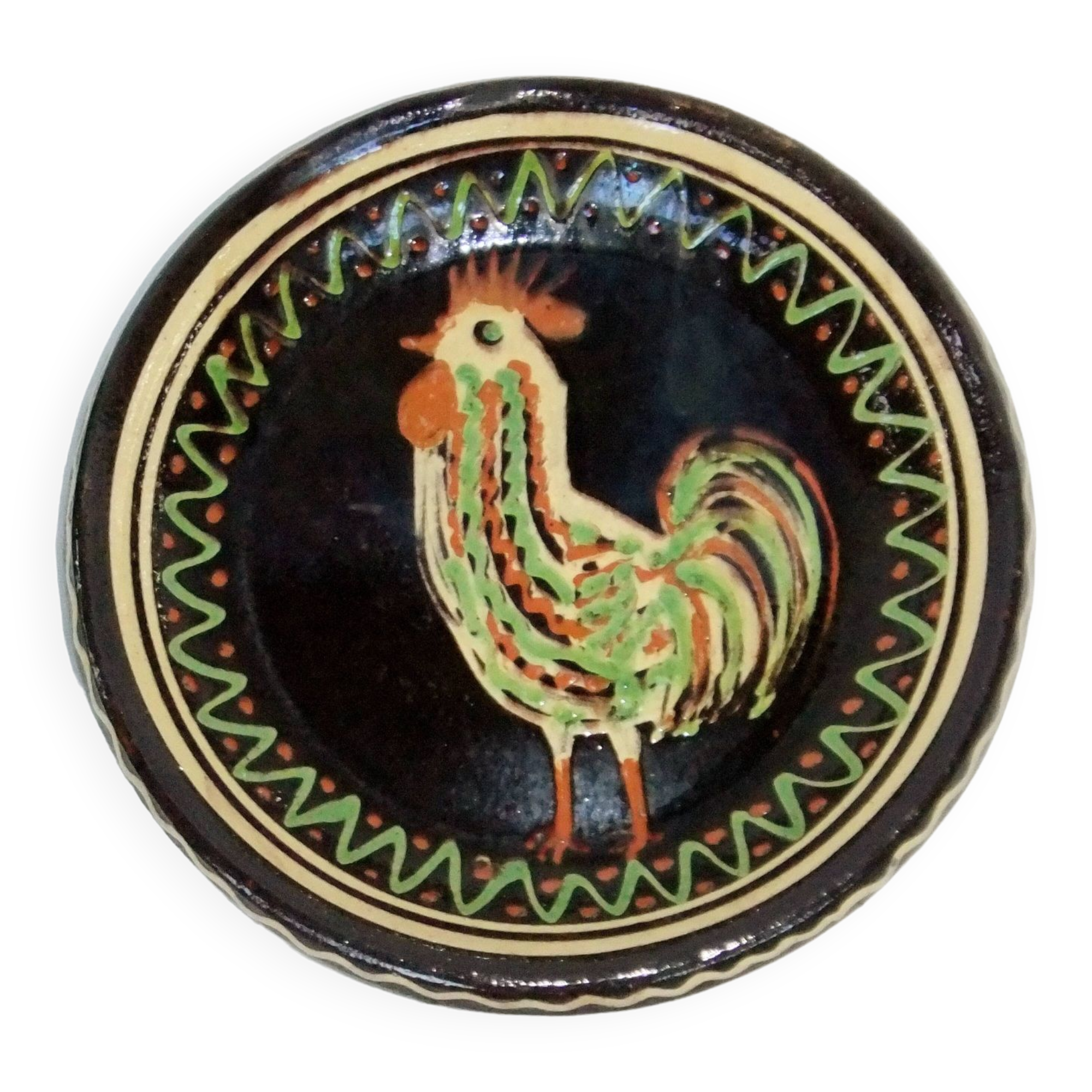 old terracotta dish decorated with rooster