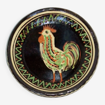 old terracotta dish decorated with rooster