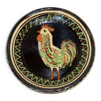 old terracotta dish decorated with rooster