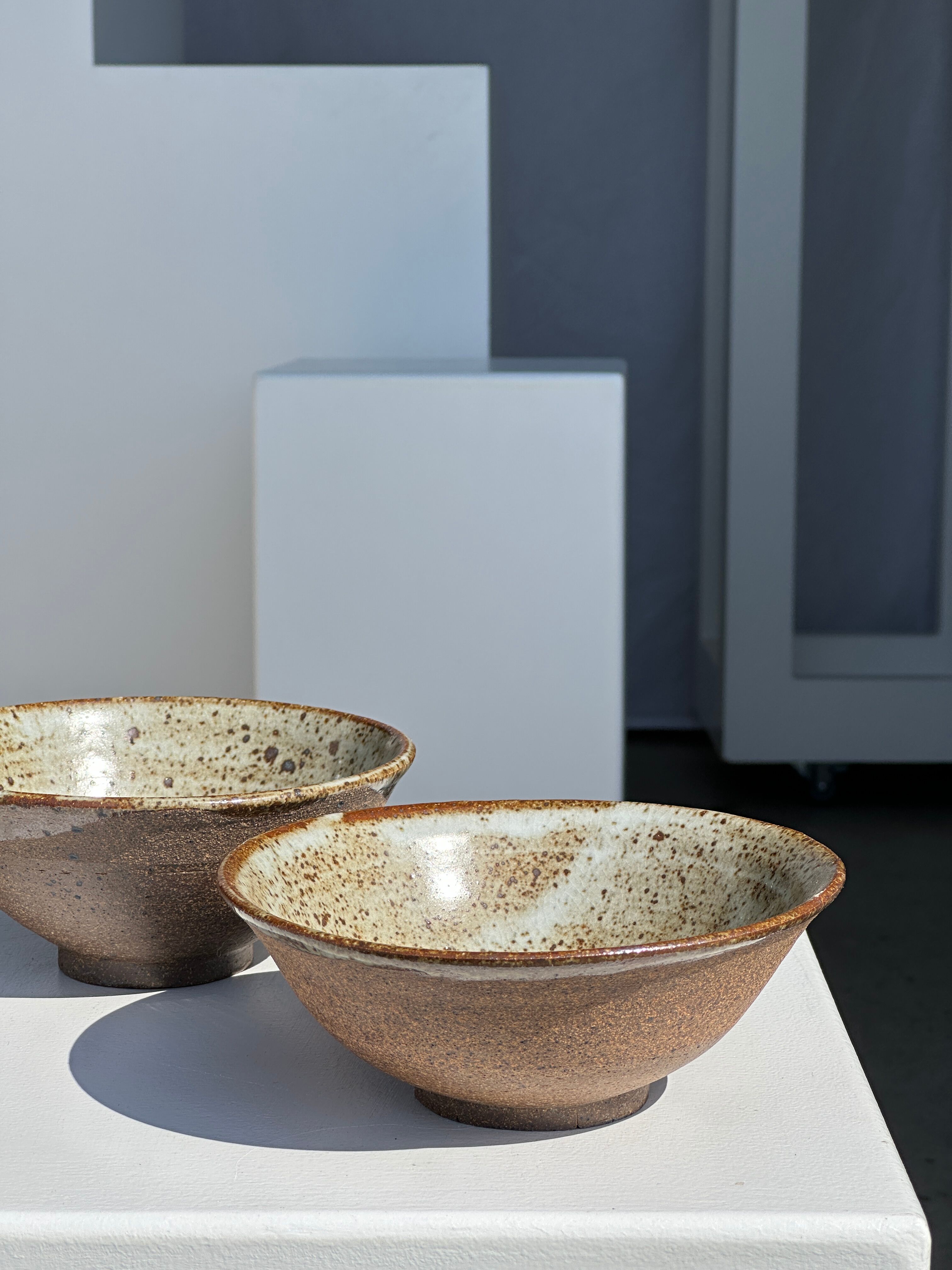 Duo of ceramic bowls interior glazed exterior matt raw earth