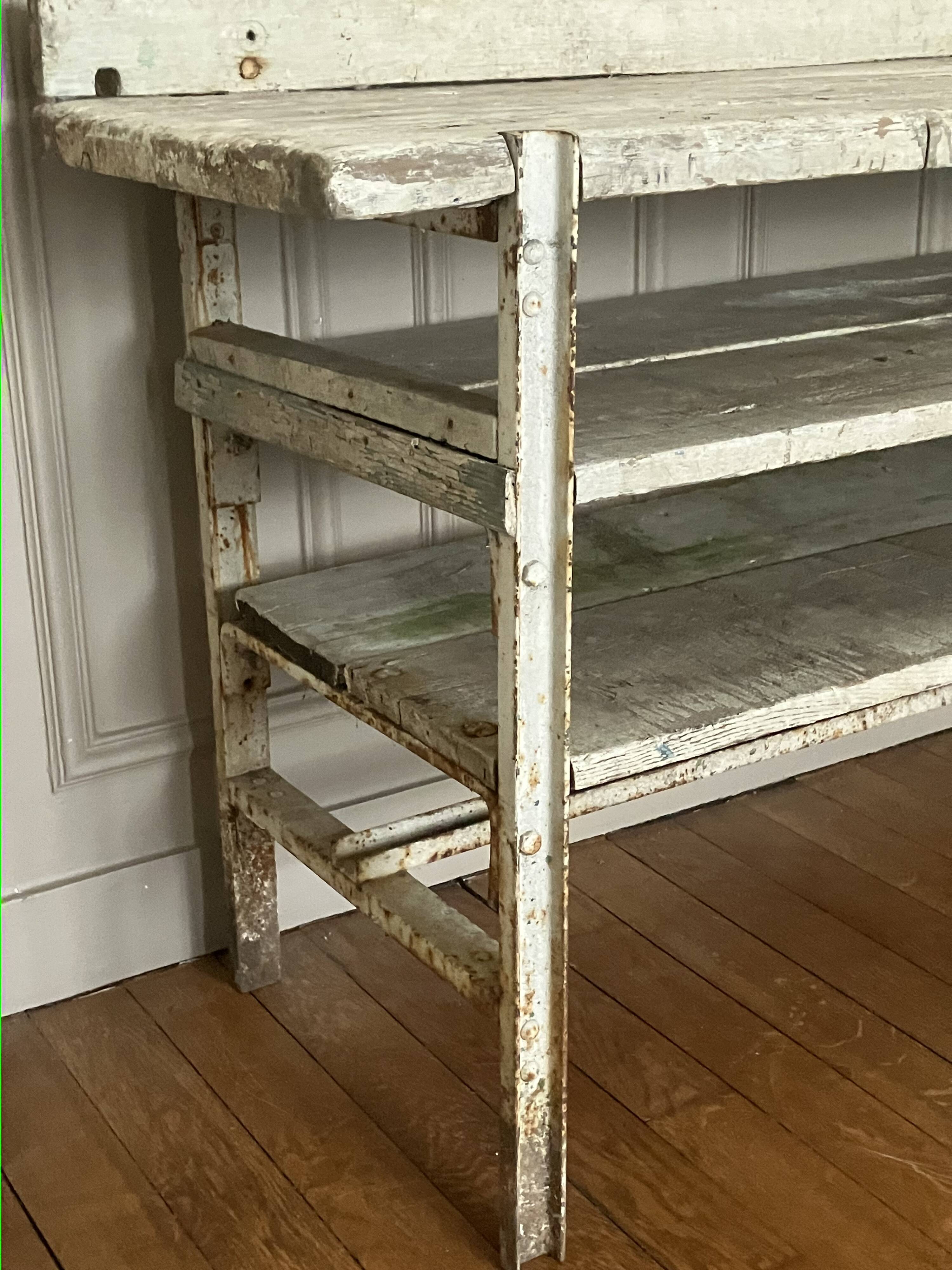 Old workbench, a piece of wooden and metal furniture.