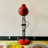 Old articulated desk lamp in red metal