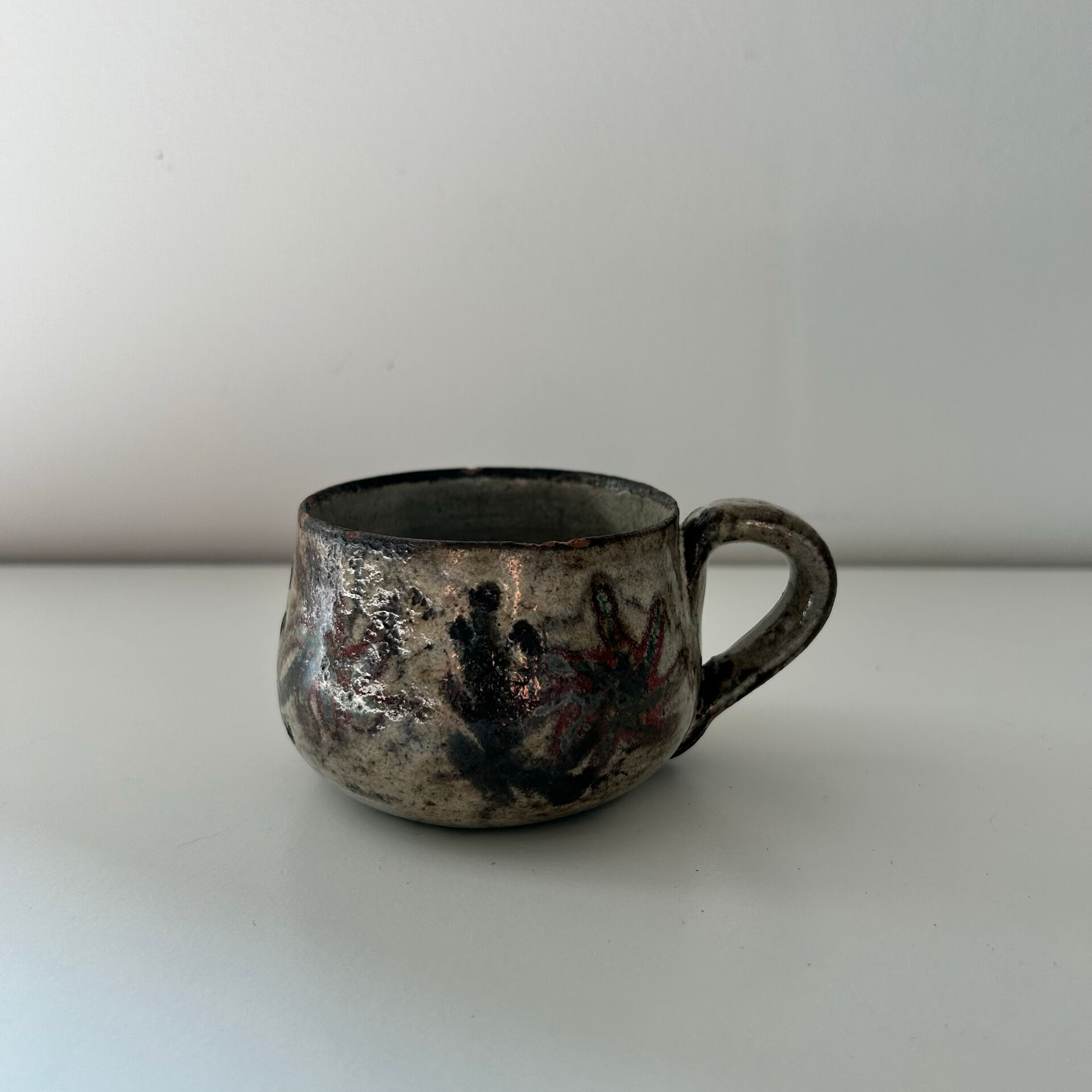 Handcrafted mug with floral decoration