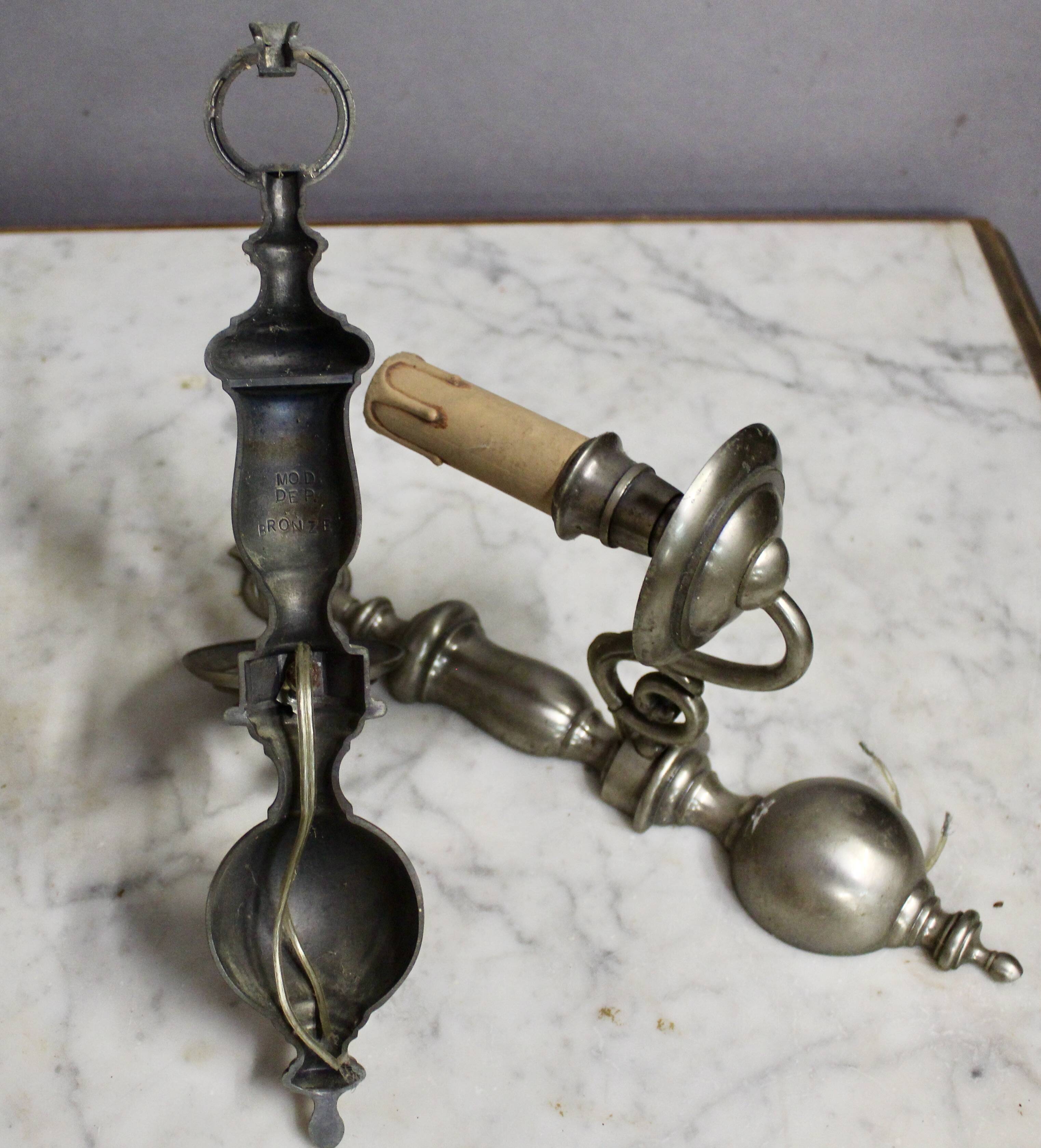 Pair of pewter-colored bronze wall sconces