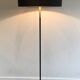Floor lamp in black lacquered metal and brass