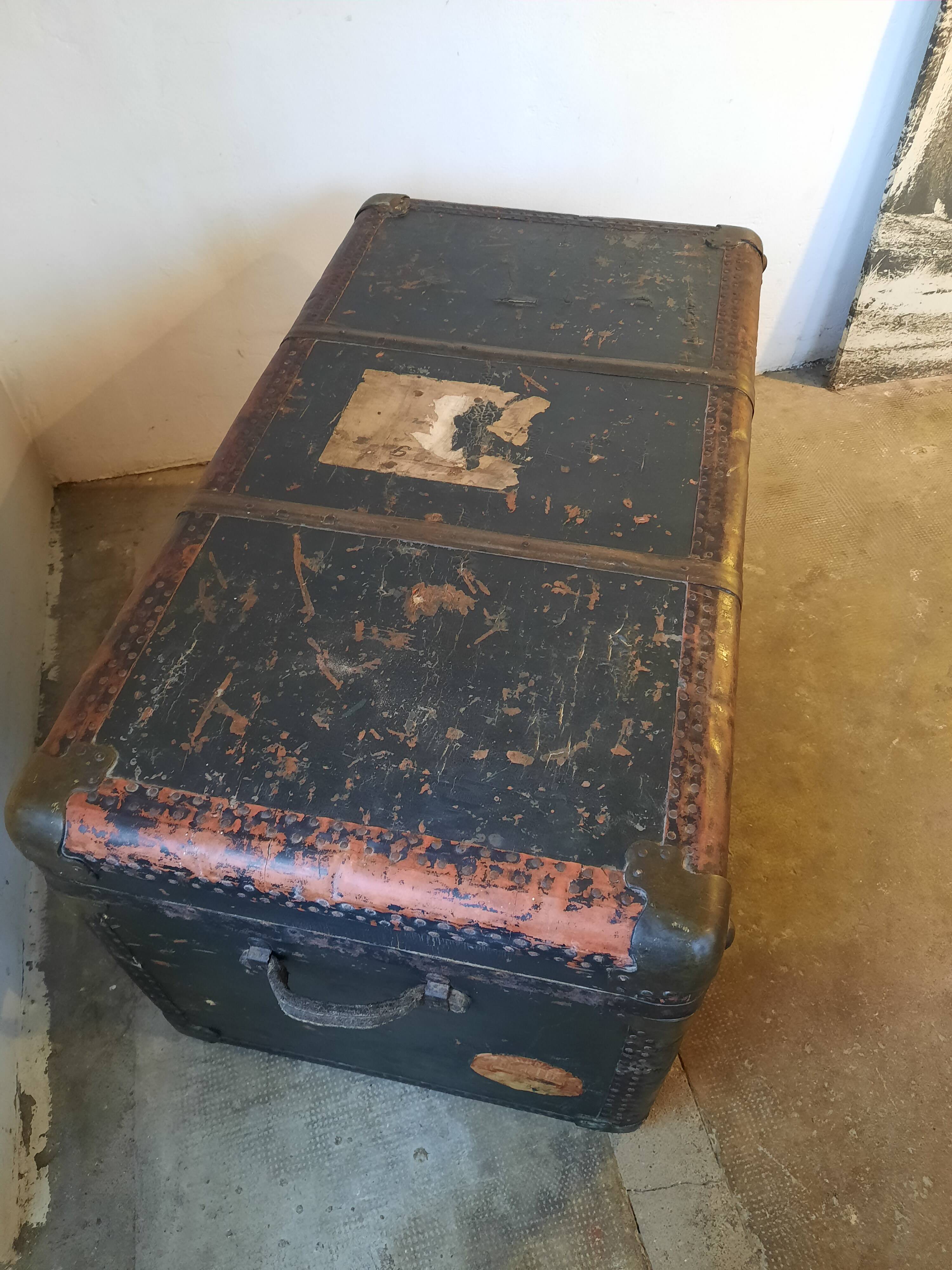 Old and large travel trunk, brass-plated corners