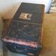 Old and large travel trunk, brass-plated corners