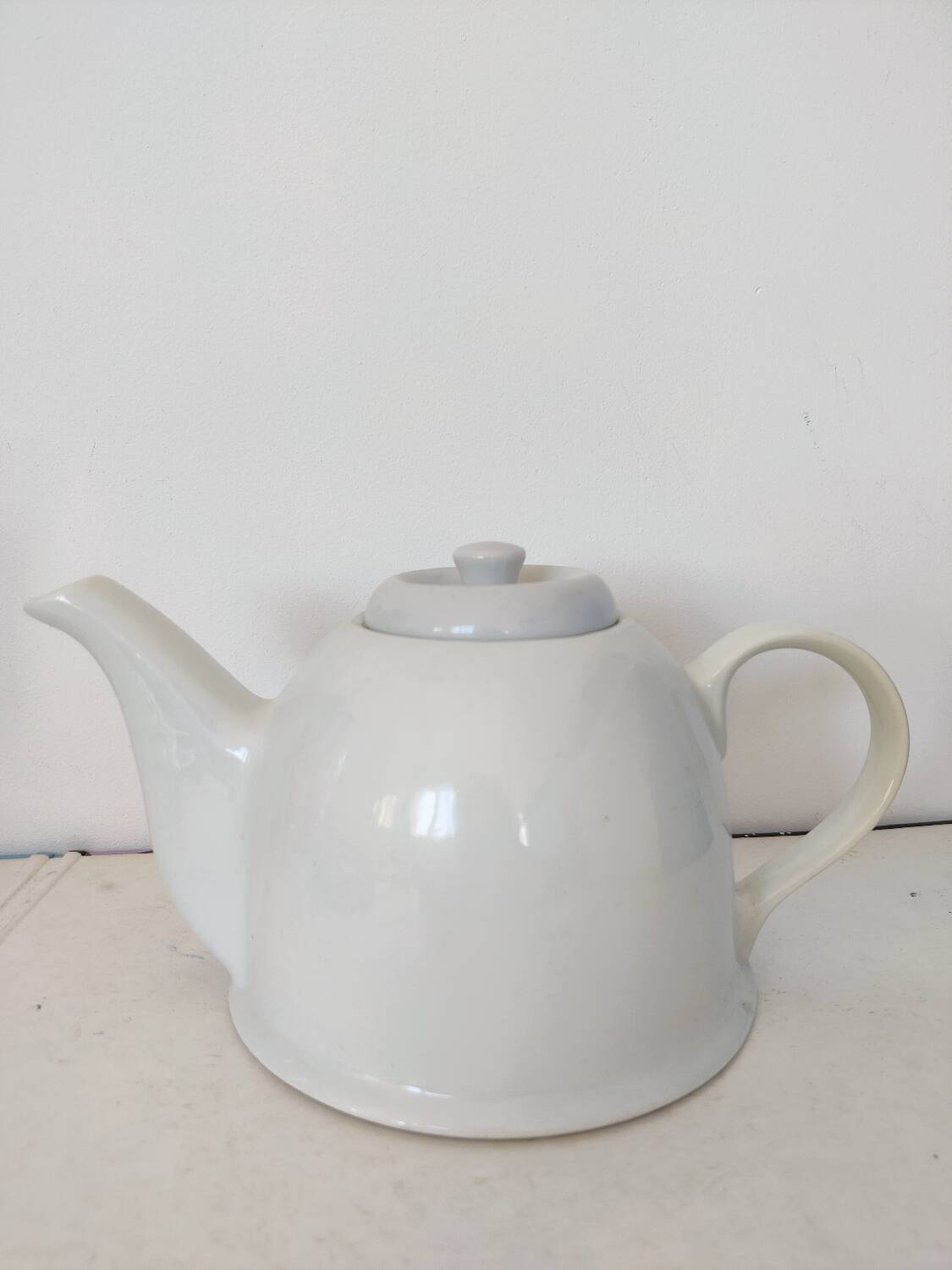 Small white porcelain teapot
