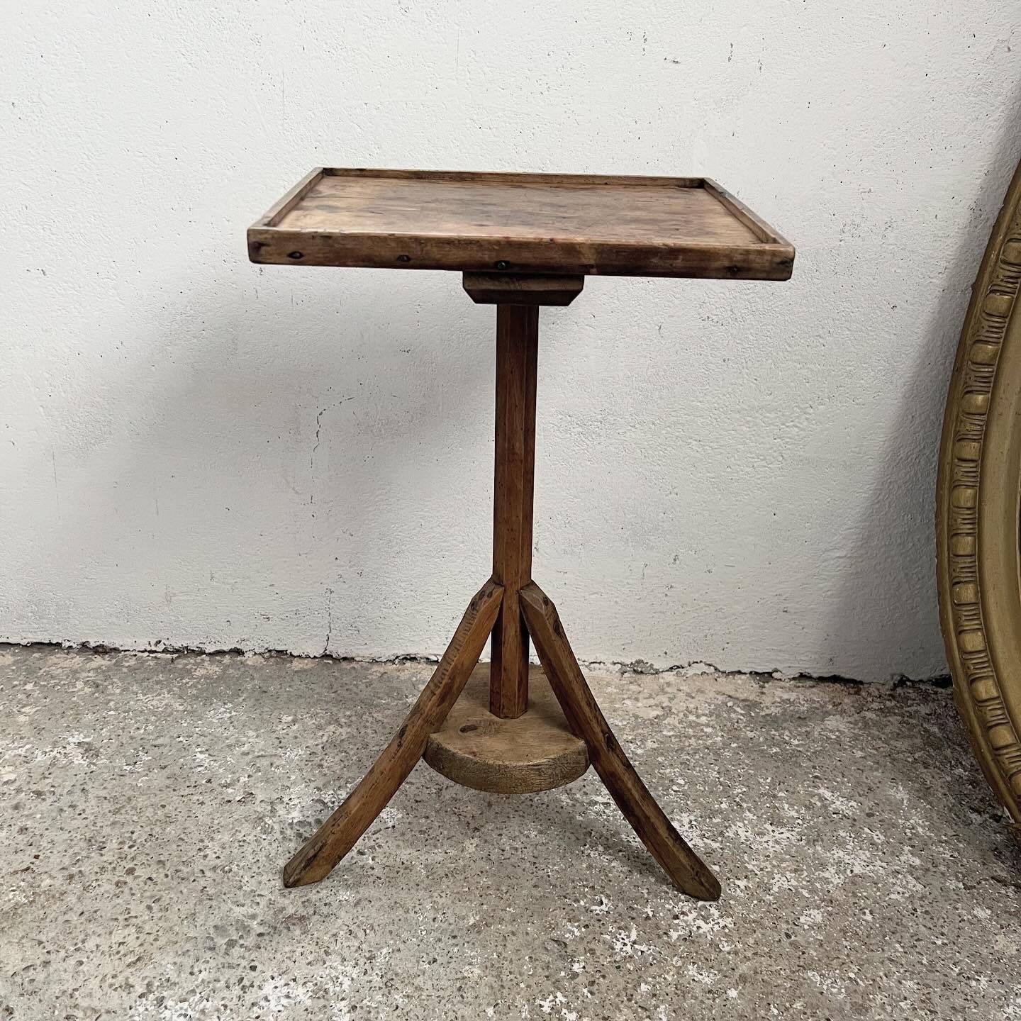 Old primitive wooden tripod pedestal table