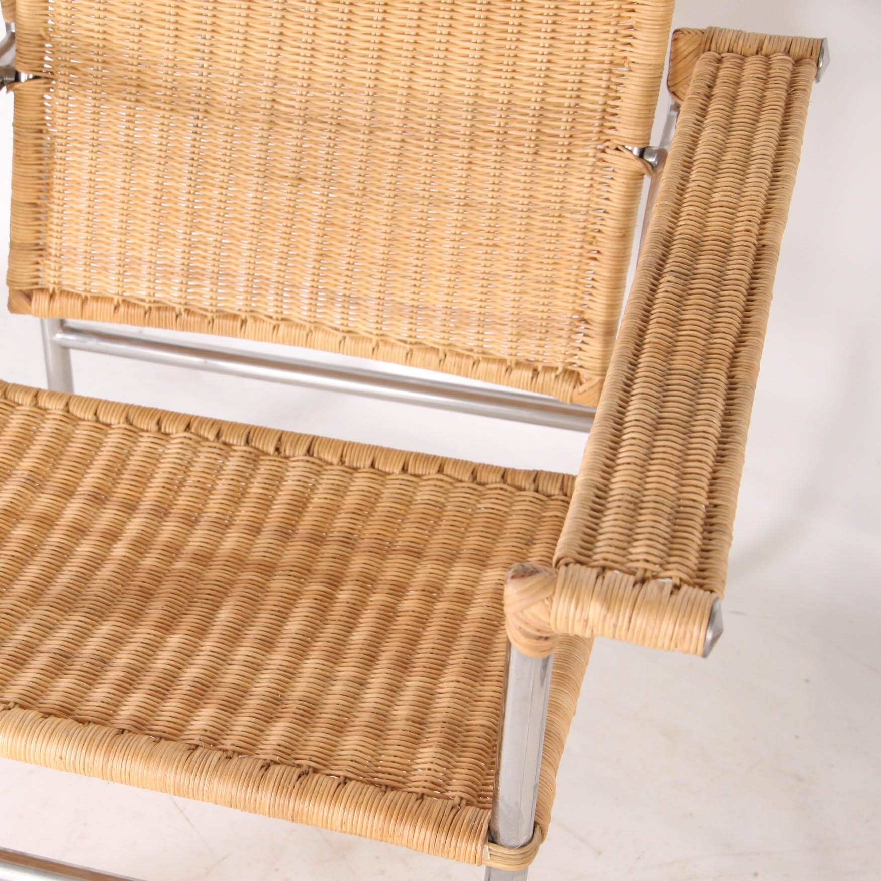 Pair of wicker and chrome armchairs