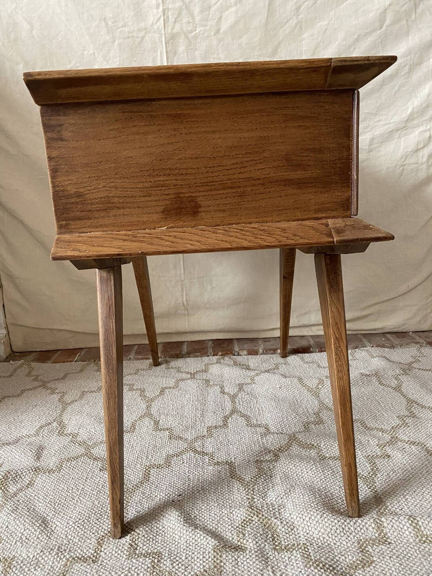 Scandinavian style bedside table with tapered legs from the 1960s.