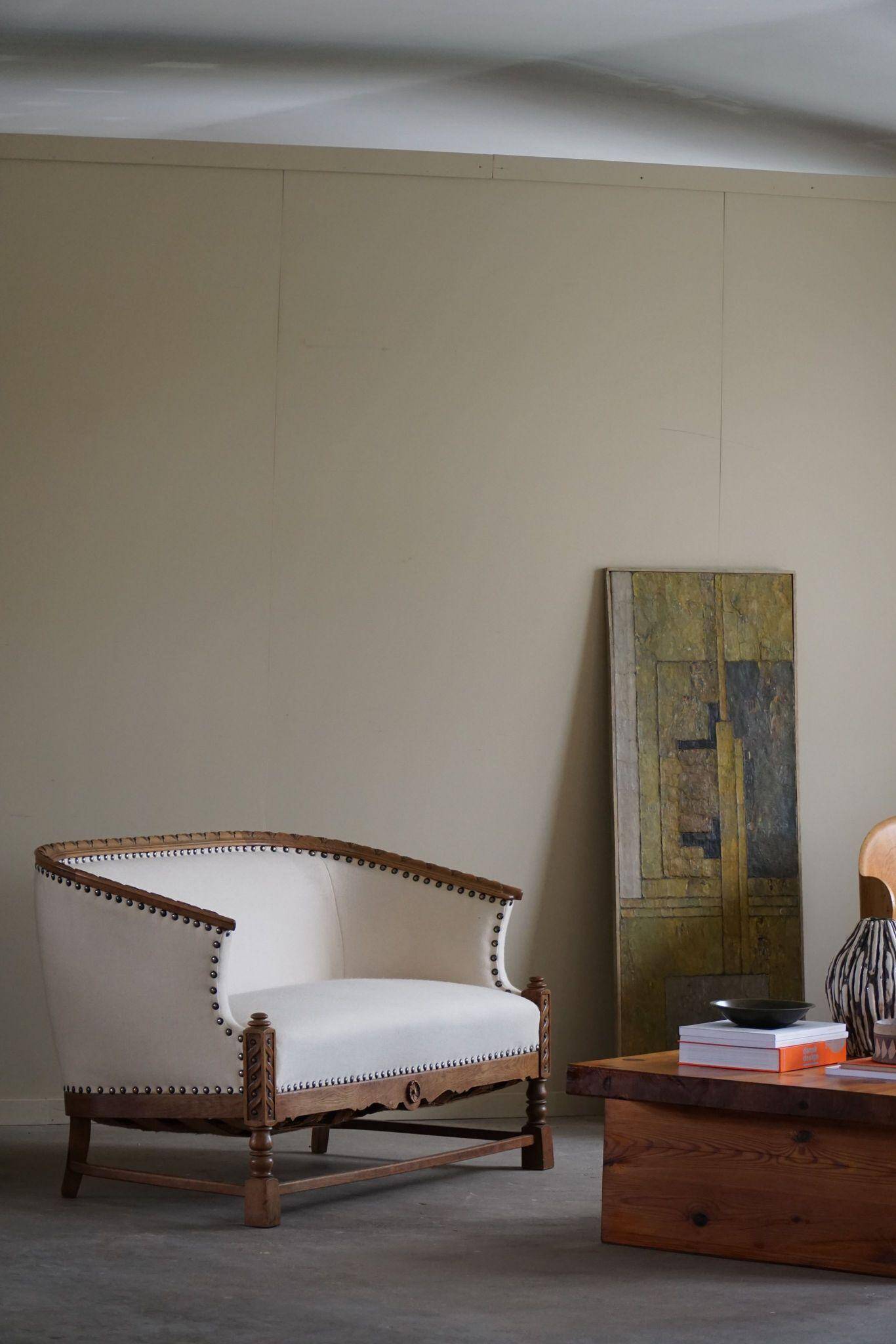 Sculptural 2-seater canapé in oak and wool, Danish "Skønvirke" style, 1920s.