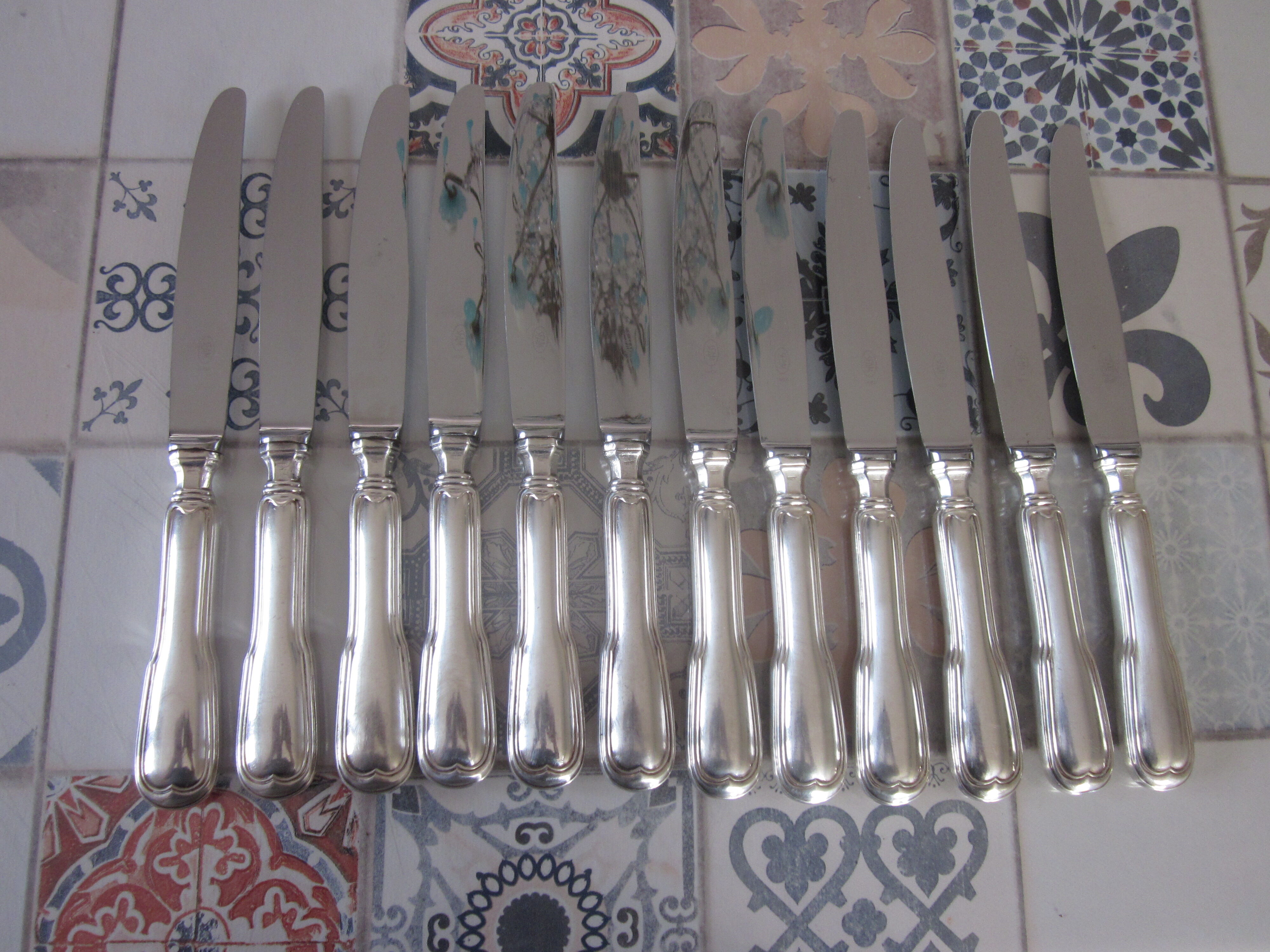 12 silver metal knives