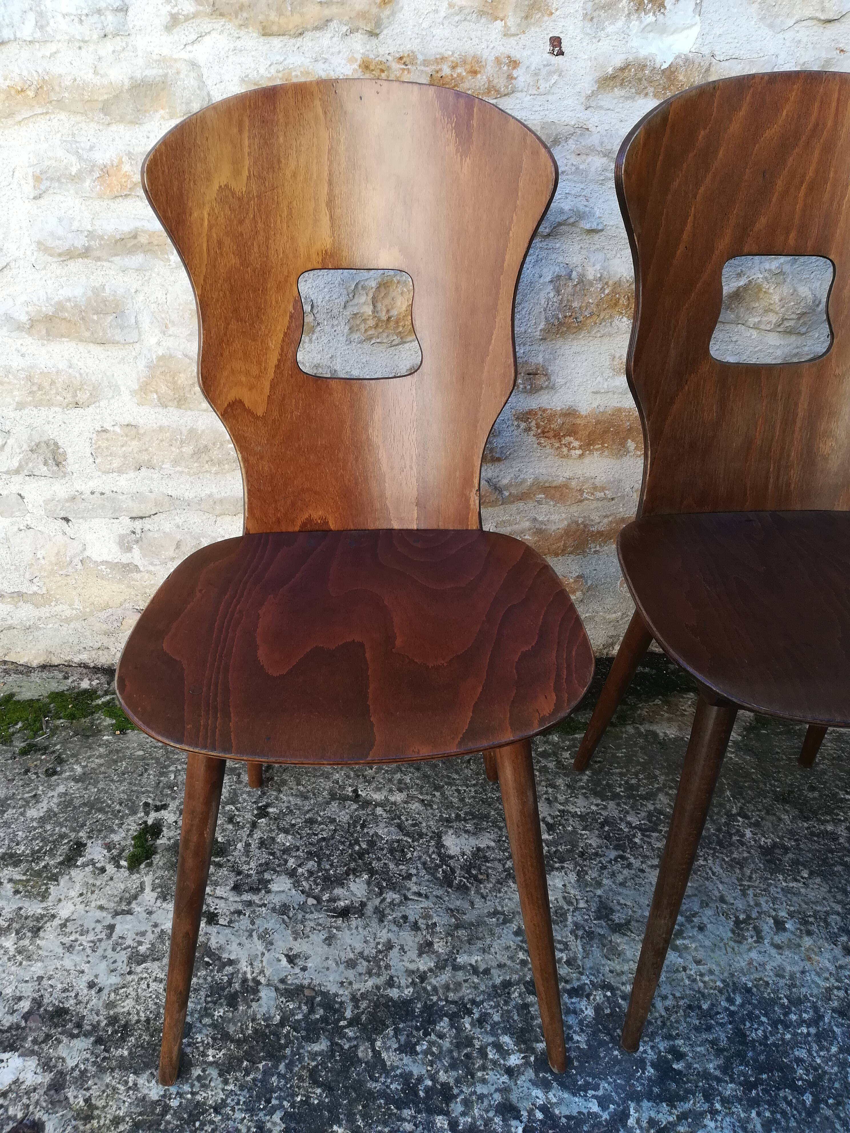Eight mismatched bistro chairs
