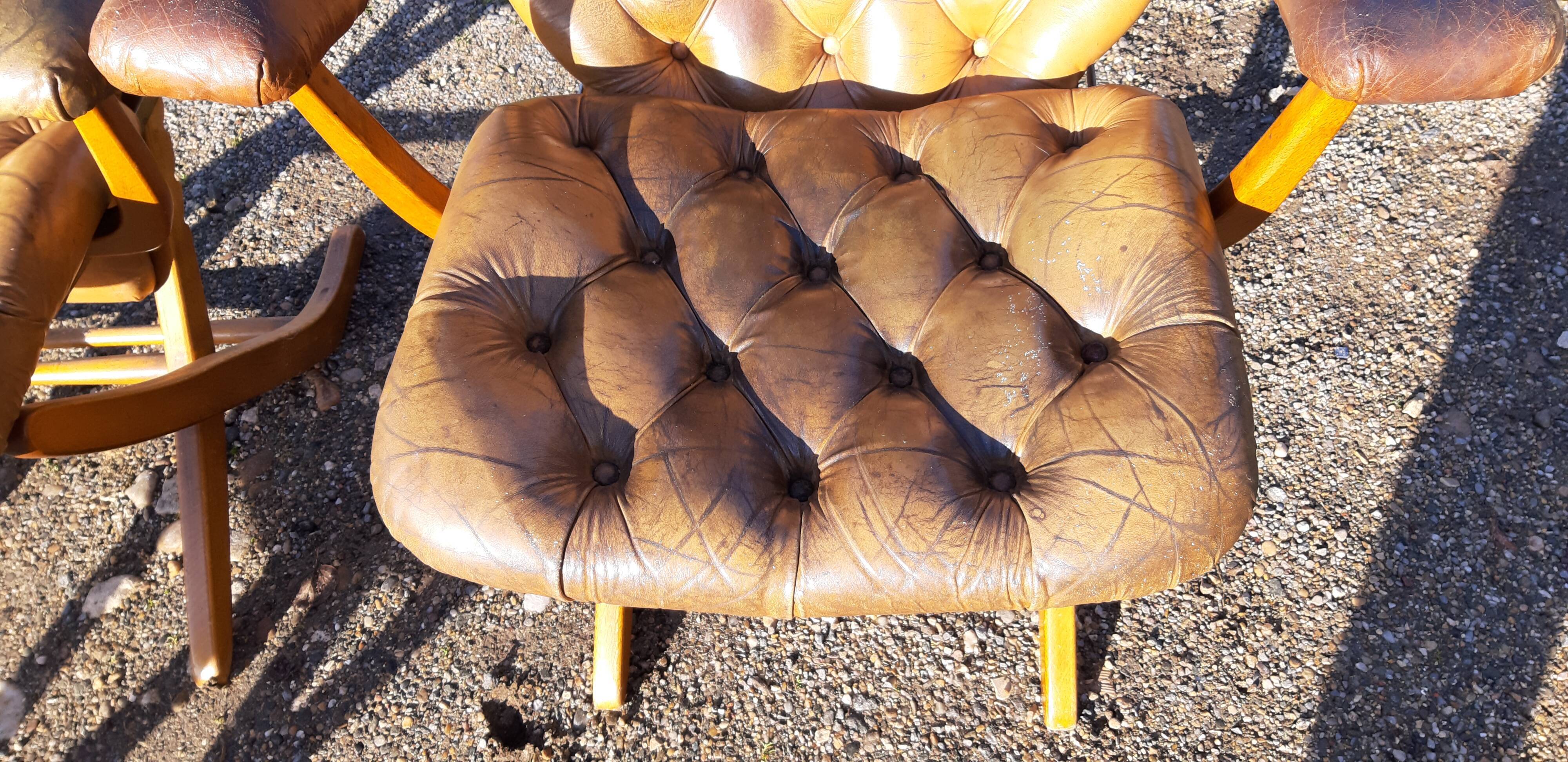 Pair of chesterfield style leather armchairs