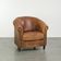 Aged sheepskin clubchair with beautiful vintage patina and comfortable seat