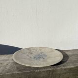 Round ethnic handmade fish dish