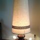 Floor lamp with Fat Lava ceramic foot and fabric lampshade.