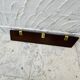 Vintage wooden and brass coat rack with 3 hooks from the 1960s.
