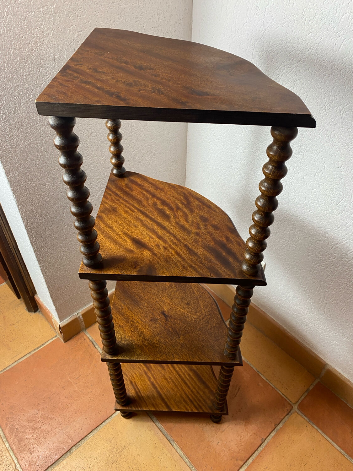 Corner shelf on a turned wooden stand
