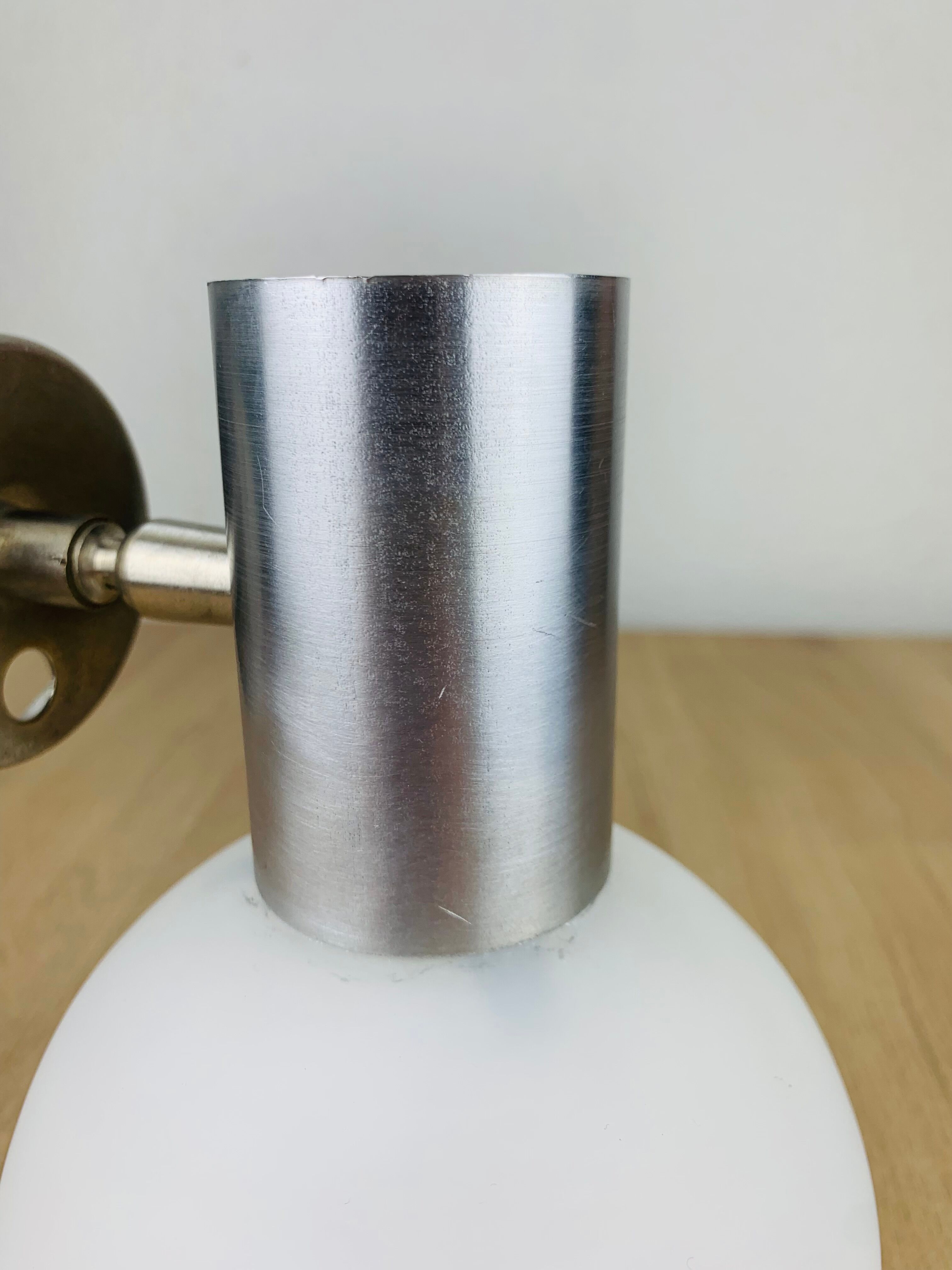 Space age opaline globe wall light, adjustable, and brushed metal, 1960s.