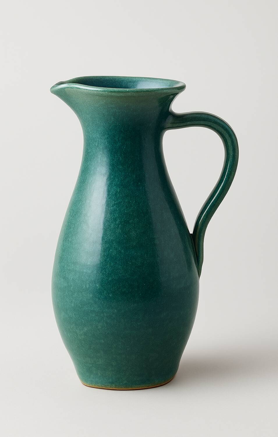 Vintage blue-green enamelled earthenware carafe