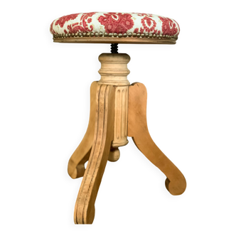 Old reupholstered screw stool