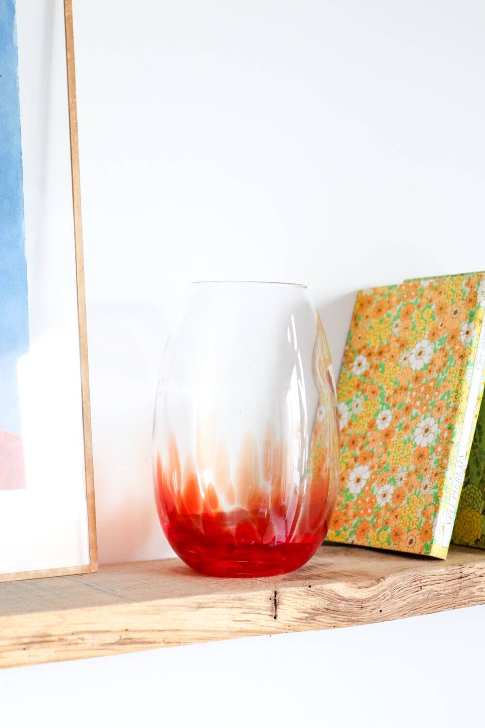 Vintage blown glass vase with a speckled red design