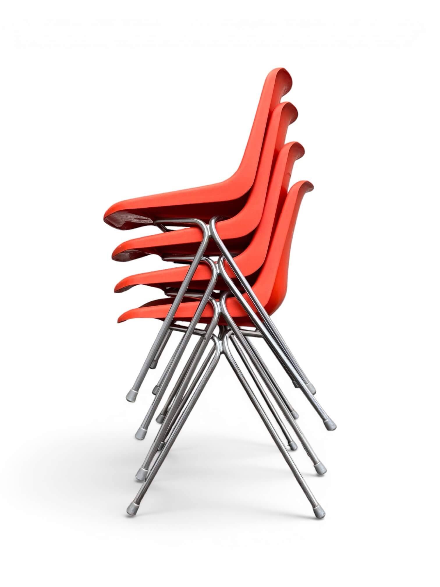 Set of 4 orange chairs designed by Robin Day for Hille.