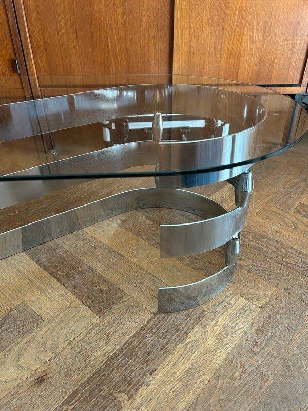 70s oval design coffee table in glass with chrome S legs.