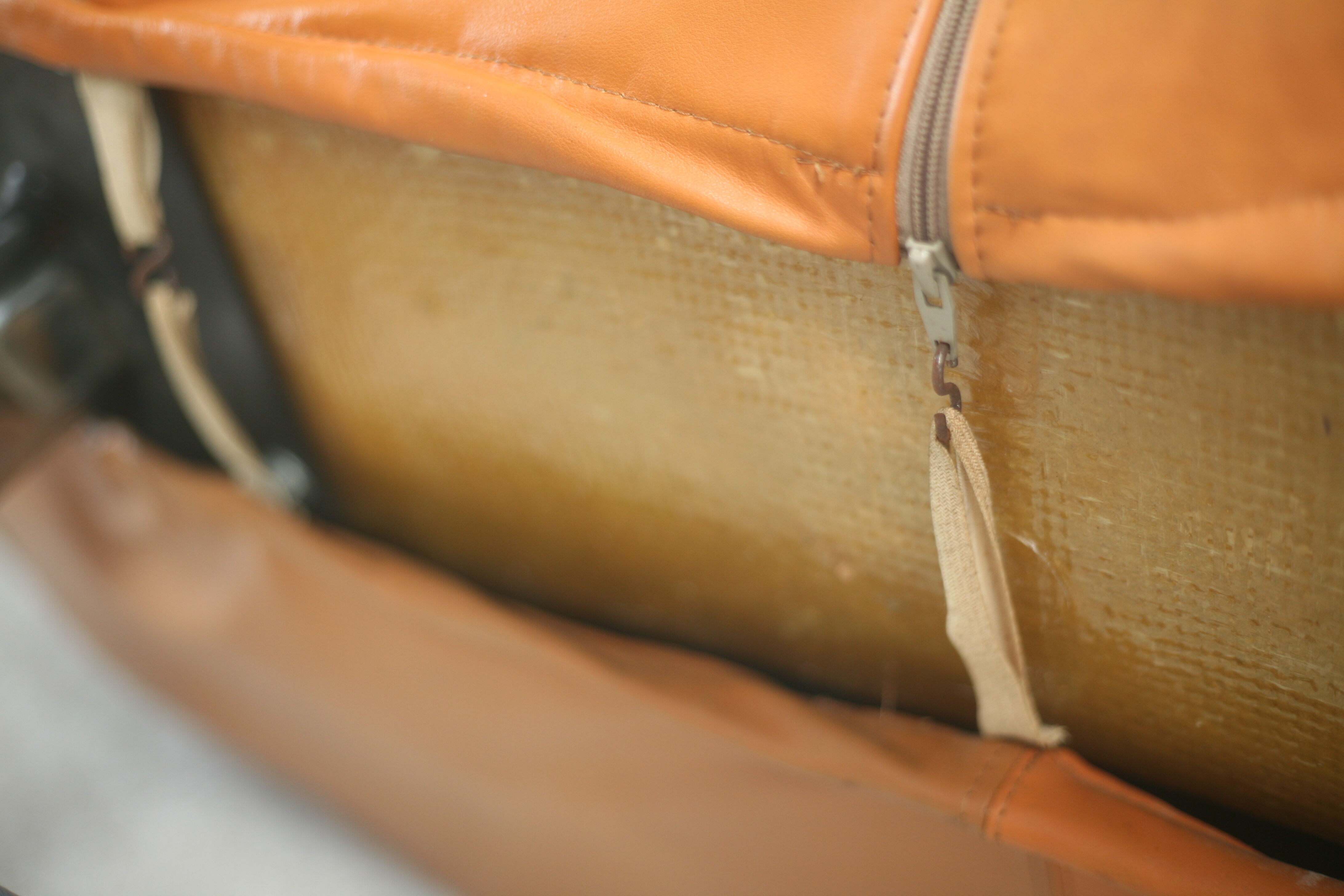 Sofa "space age". Leather, fiberglass, foam, steel. Circa 1970. Orange.