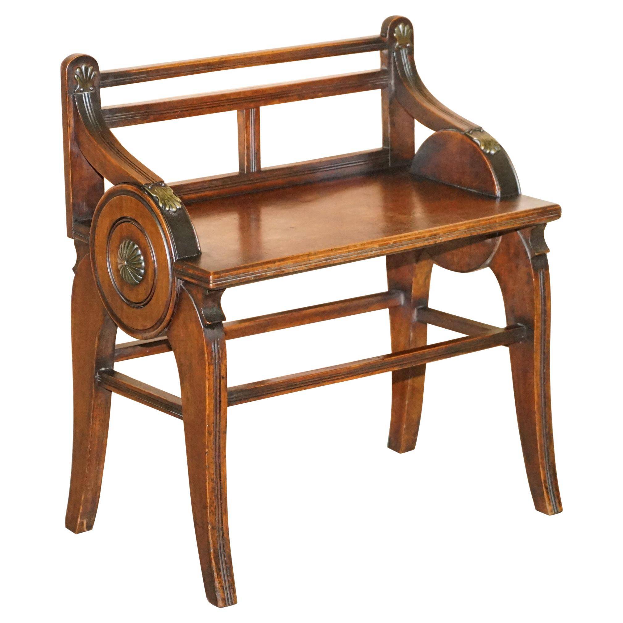 Antique entrance bench by Jas Shoolbred with brass fittings and walnut frame circa 1890.