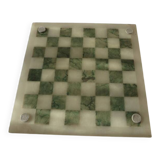 Onyx chessboard and complete wooden chess set.