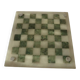Onyx chessboard and complete wooden chess set.