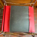 2 tubular chairs in red leather 1970