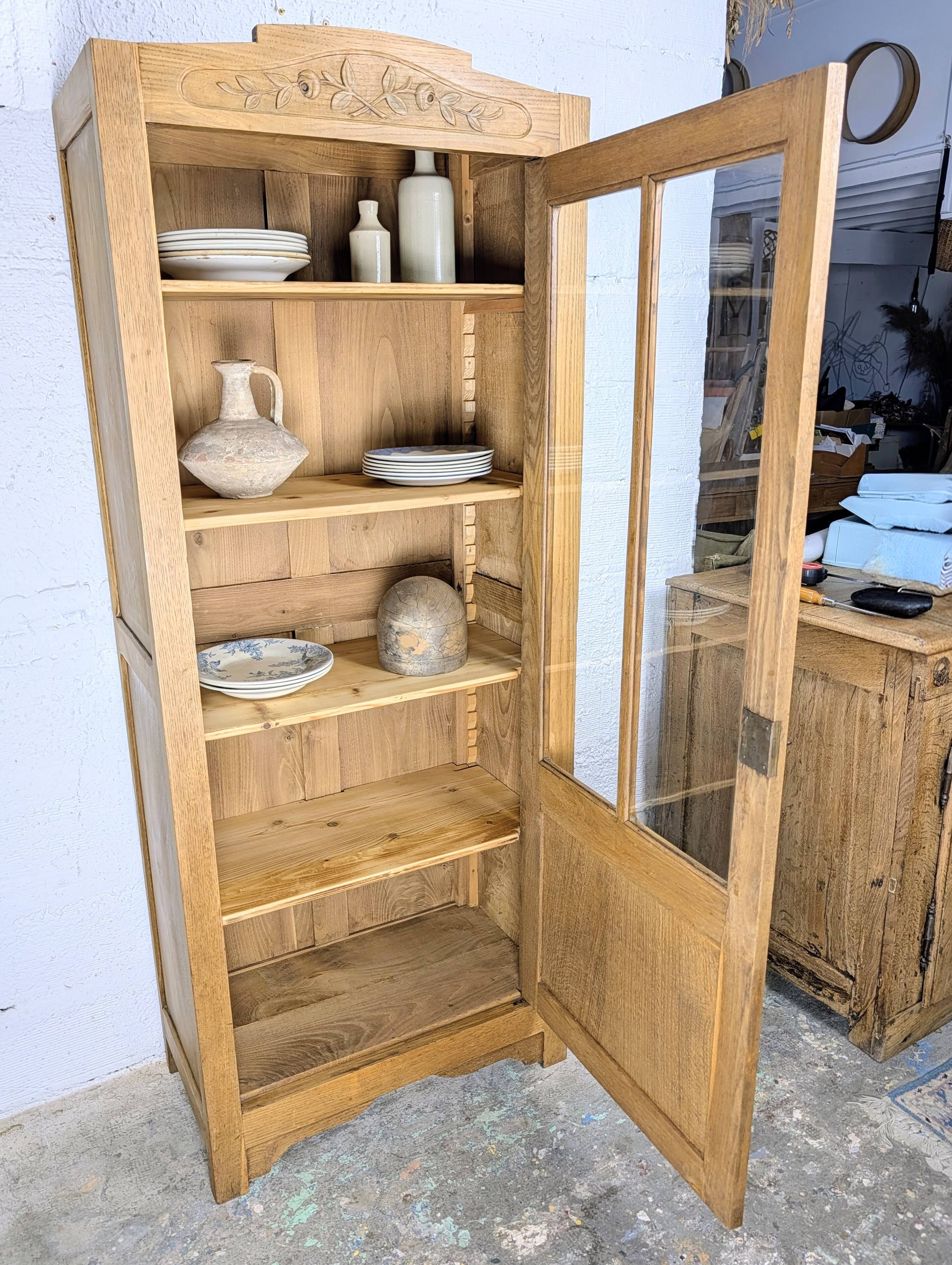 Glass-fronted cabinet from the 1930s-1940s.
