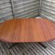 Oval teak table extendable with two leaves, Baumann style.