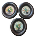 Set of three miniature flowers in a vase.