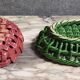 Two woven ceramic fruit baskets/centerpieces