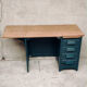 Antique desk with drawers and shelf