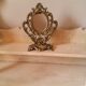 Baroque oval mirror pivoting on foot Golden brass 20x15cm