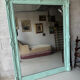Large antique mercury mirror, patinated blue sculpted frame.