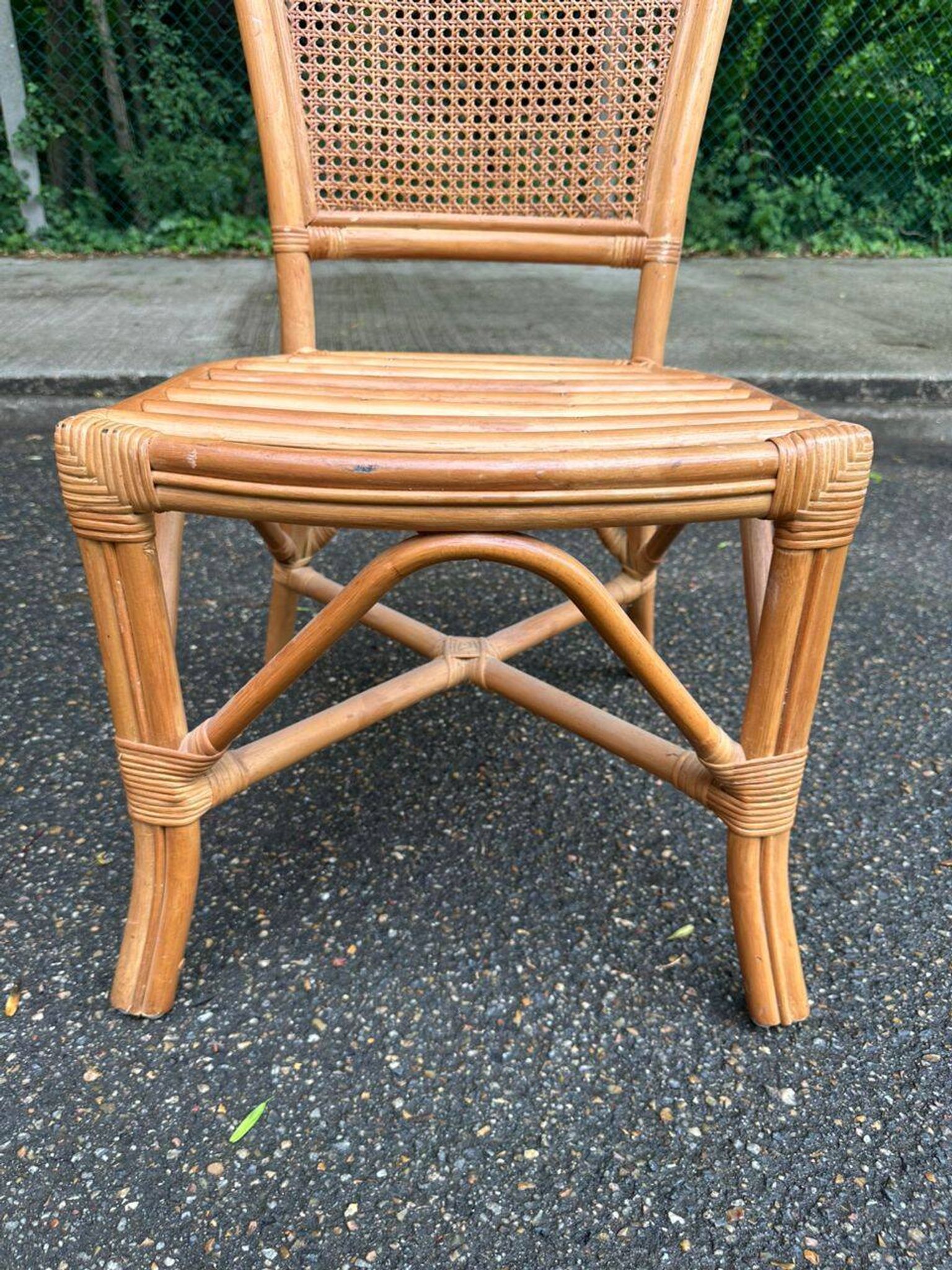 2 rattan and caned chairs in colonial bistro style from the 1990s.