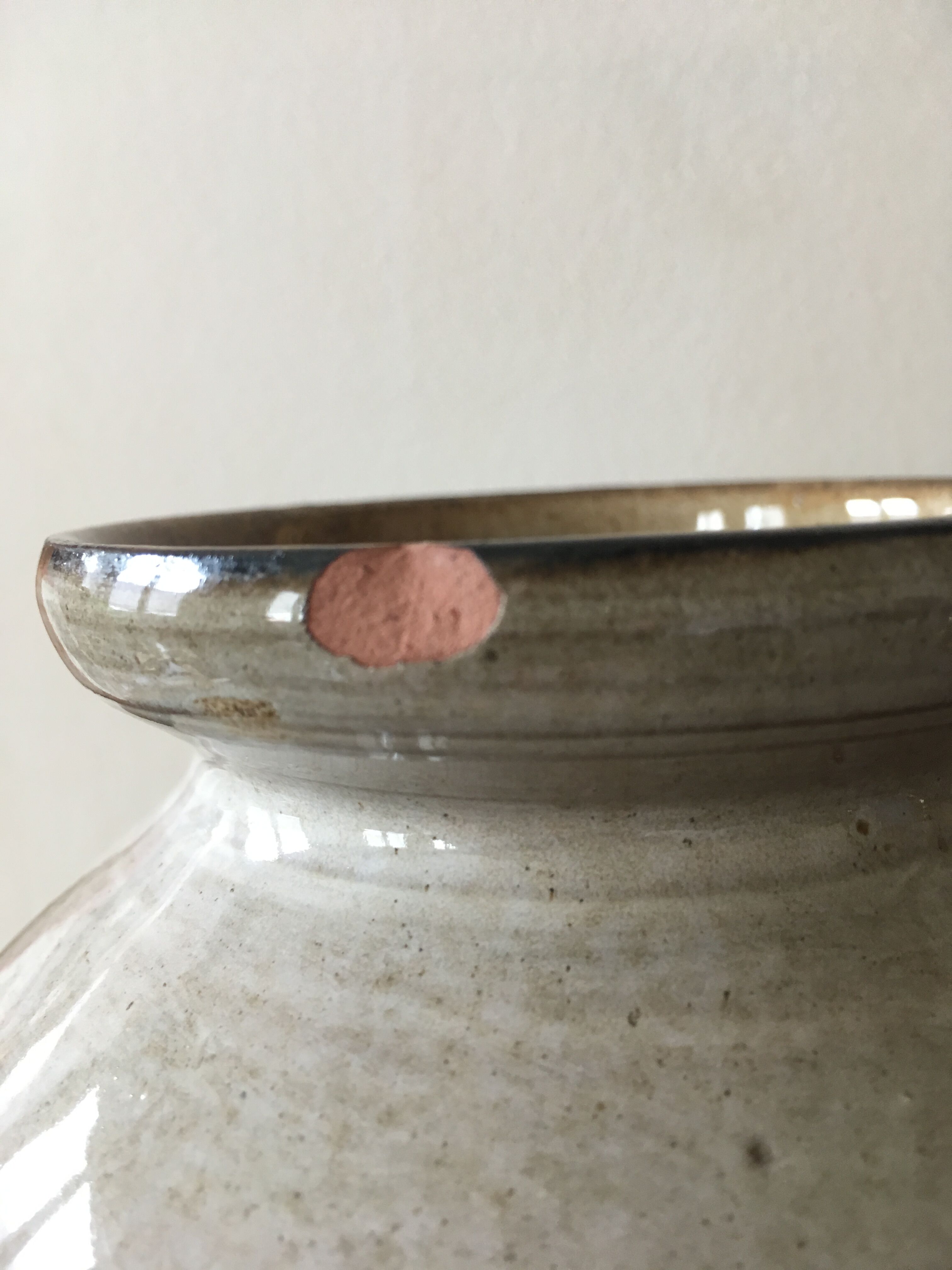 Glazed stoneware ball vase decorated with flowers