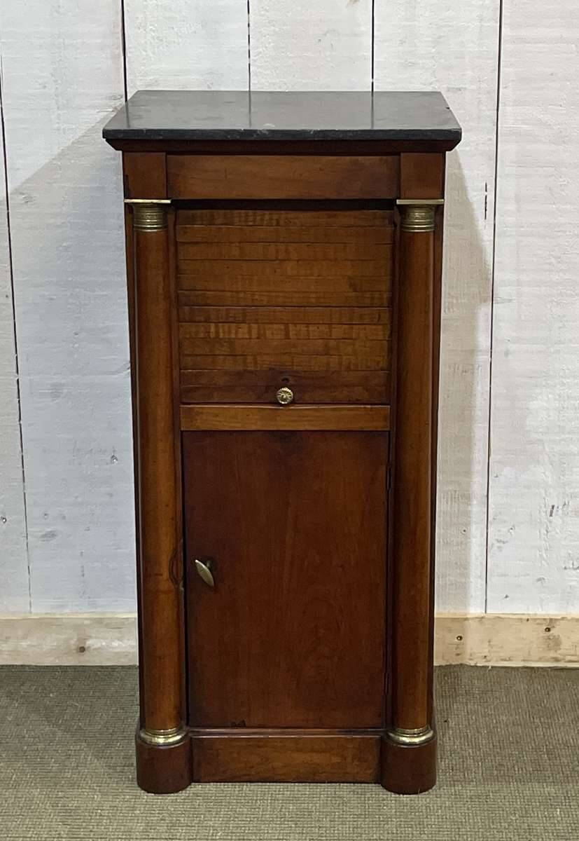 Empire bedside table from the 19th century in cherry wood and black marble.