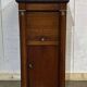 Empire bedside table from the 19th century in cherry wood and black marble.