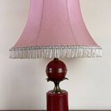 Art deco style desk lamp with a burgundy red sphere in the center the body is in lacquered iron